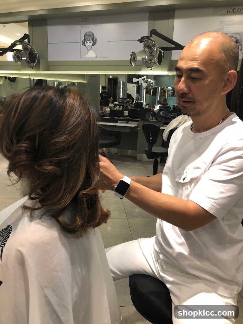 Hairdresser styling a client's hair
