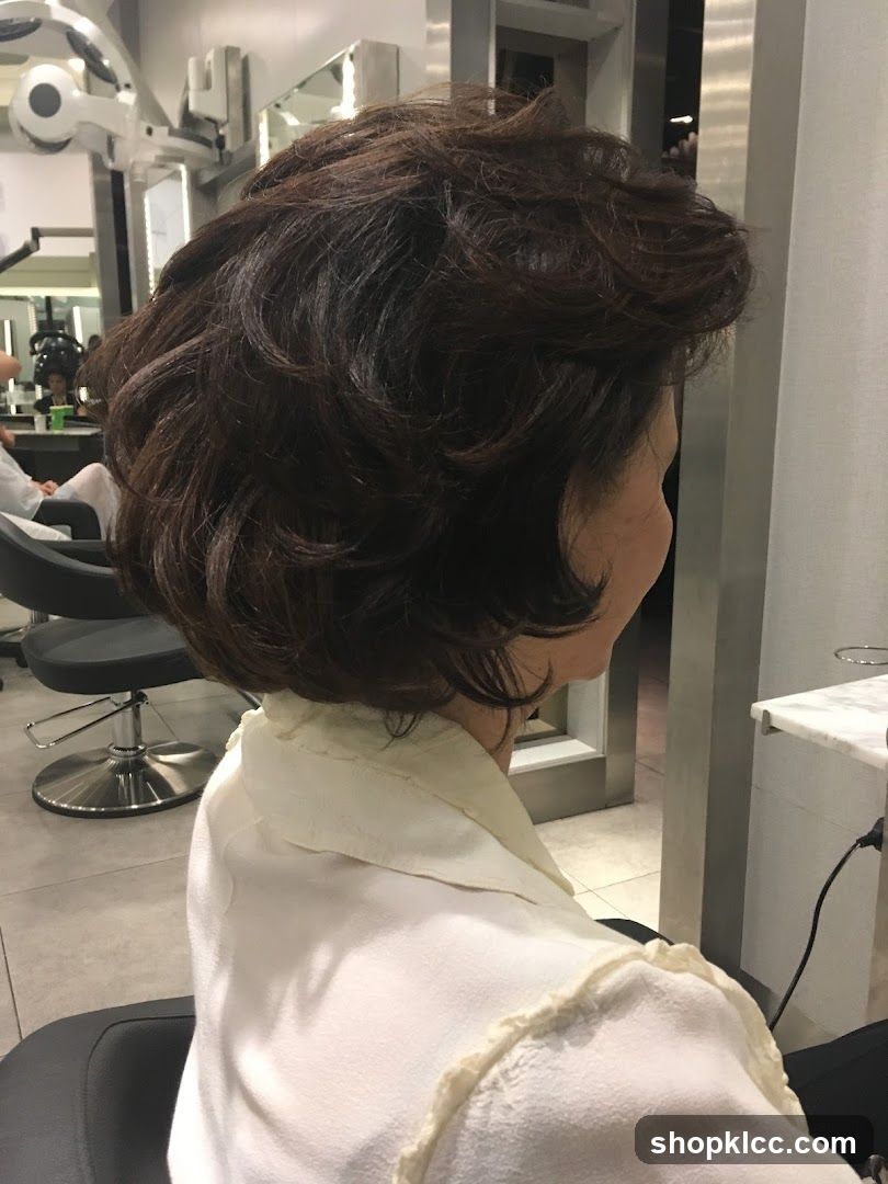 Woman with styled hair in salon