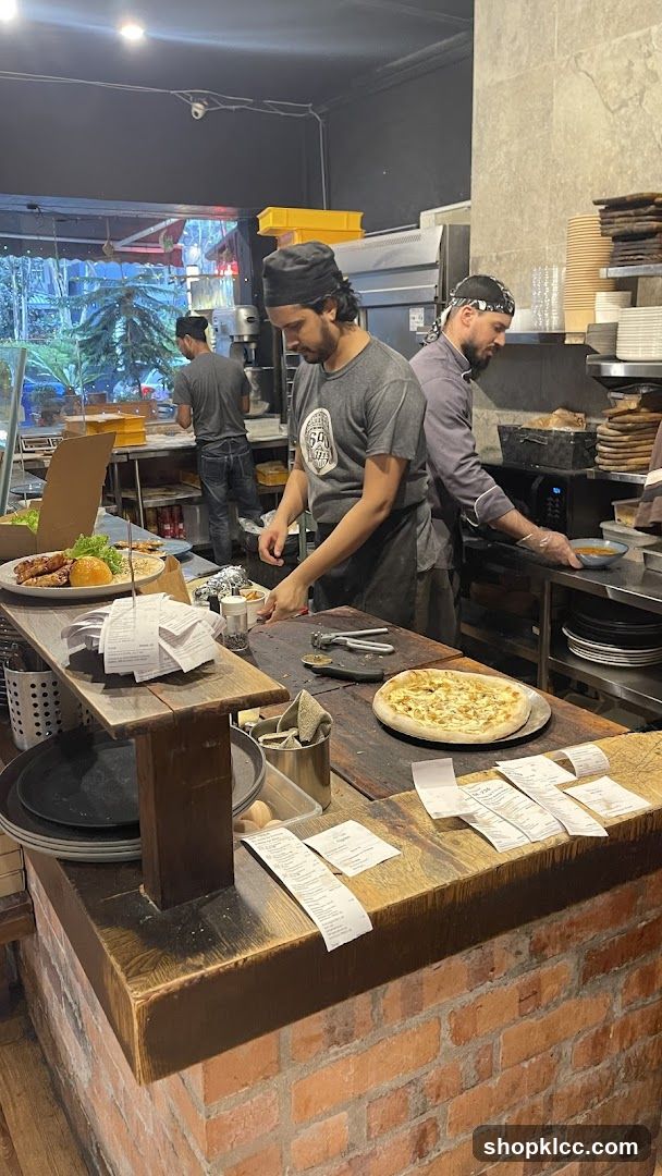 Chefs preparing food in a kitchen