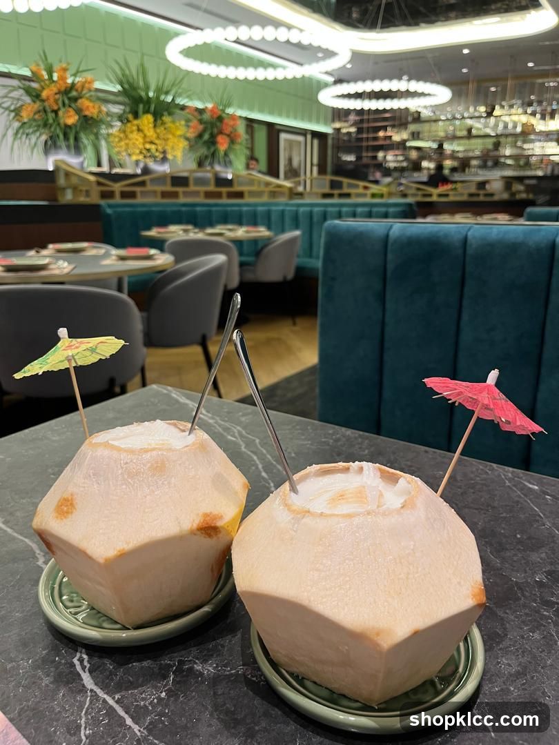 Two Coconuts with Umbrellas