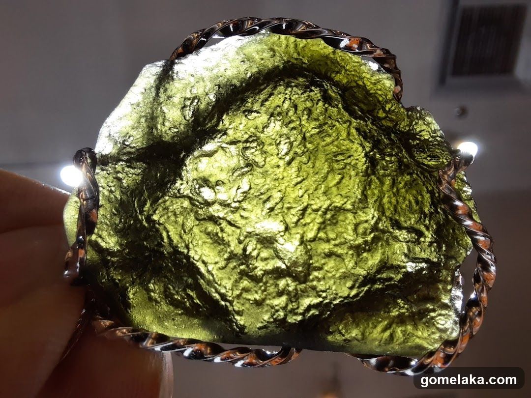 Moldavite Gemstone in Ornamental Setting