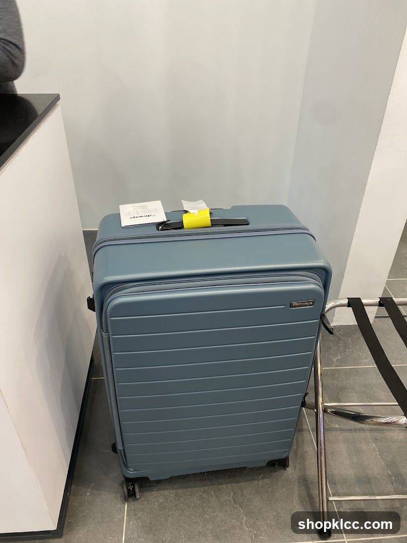 Blue Suitcase with Luggage Tag