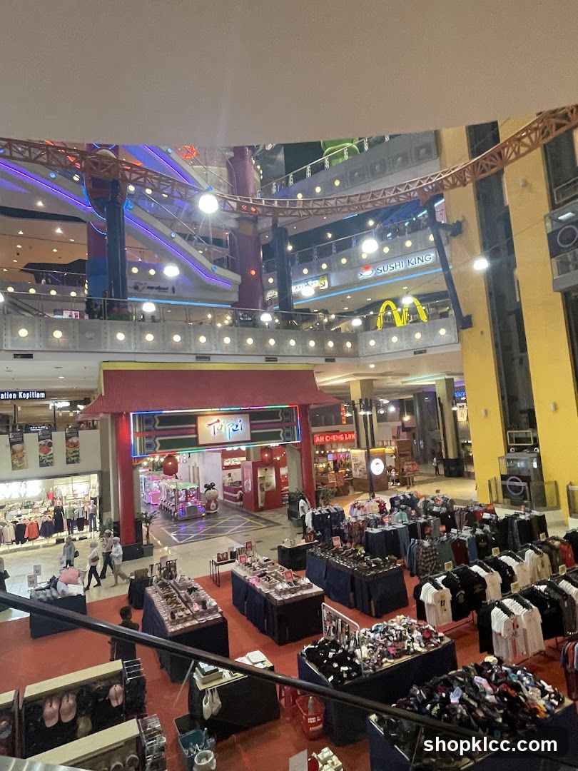 Indoor shopping mall with various stalls and shops