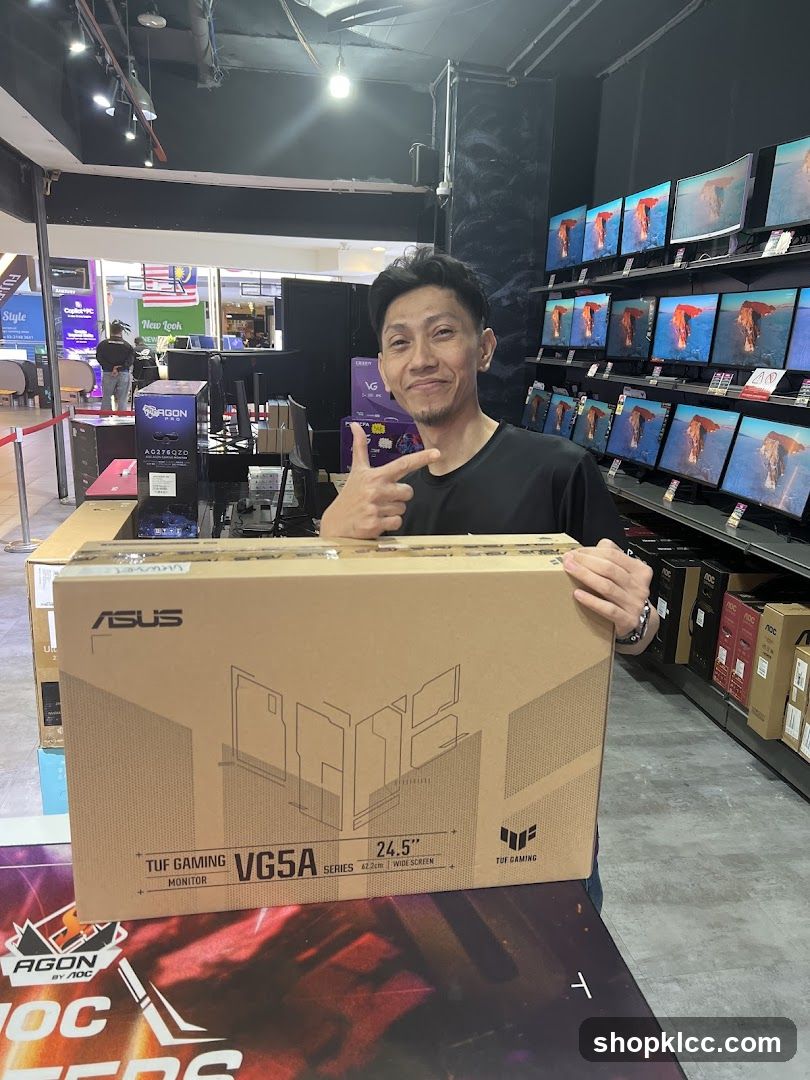Man holding a computer monitor box