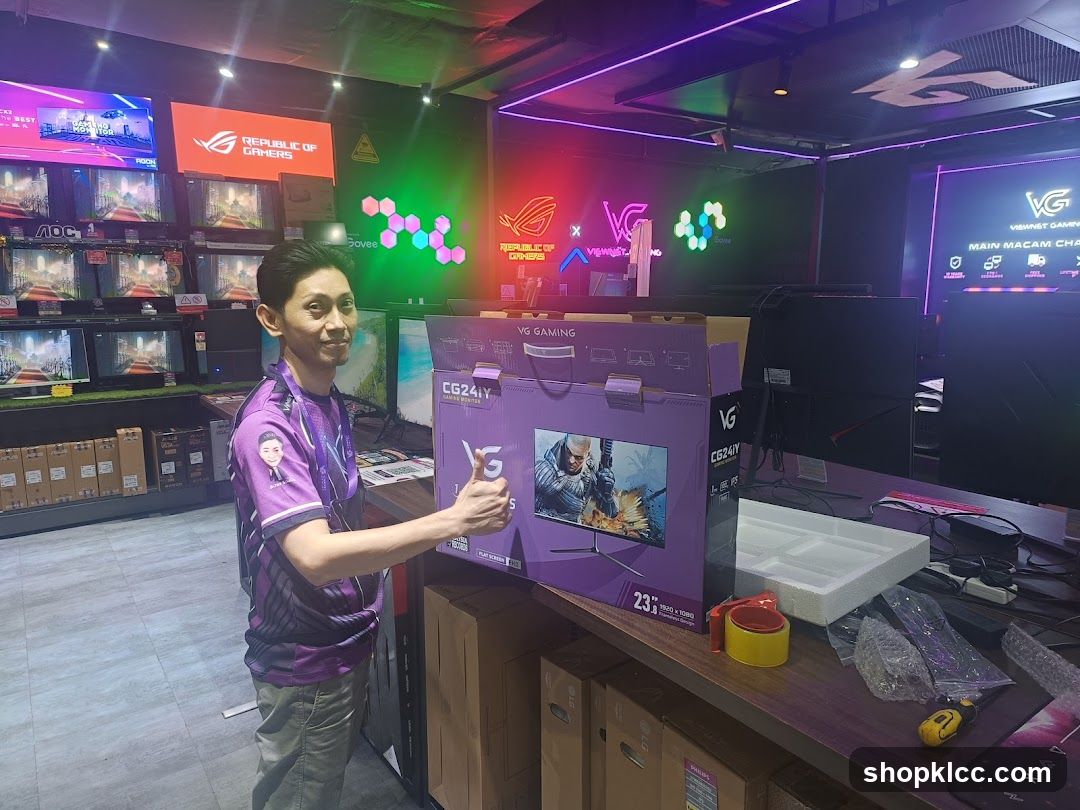 Man holding a computer monitor box
