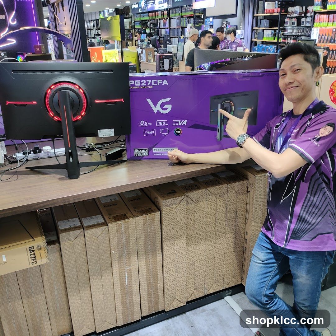 Man Posing with Gaming Monitor