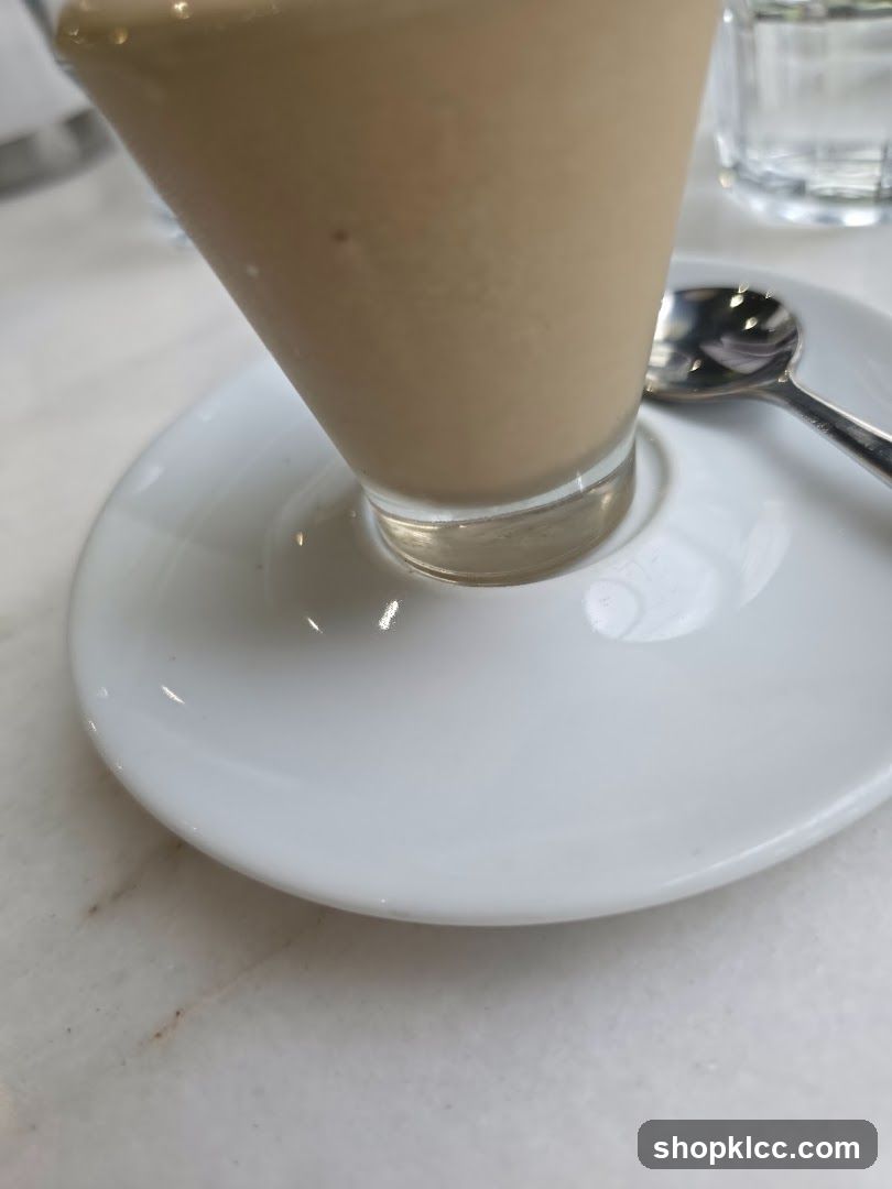 Coffee drink with spoon and saucer