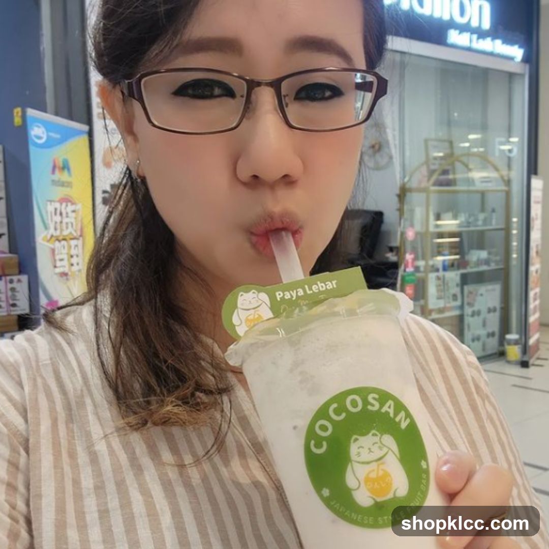 Woman Drinking a Beverage
