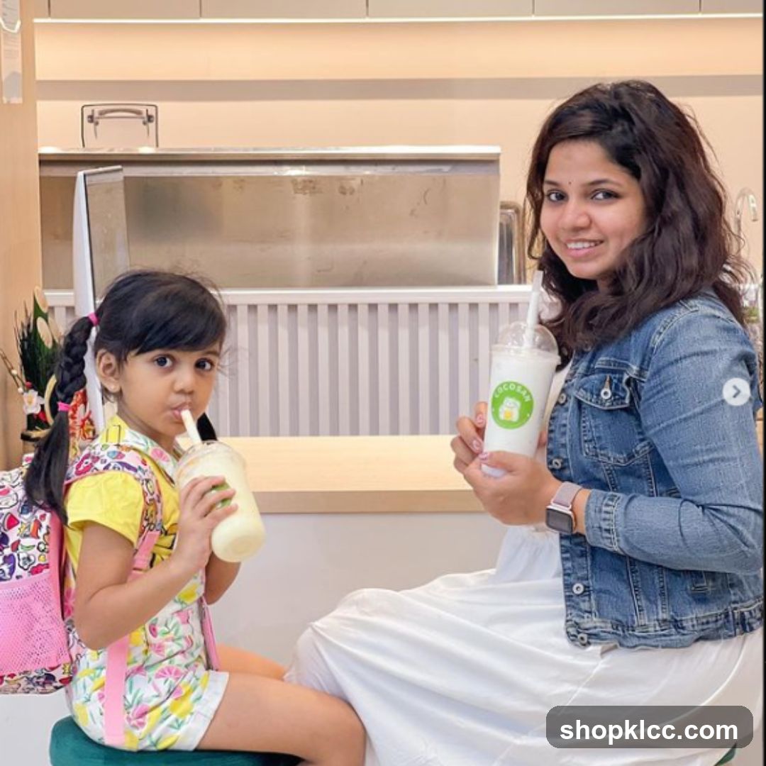 Woman and Child Enjoying Drinks
