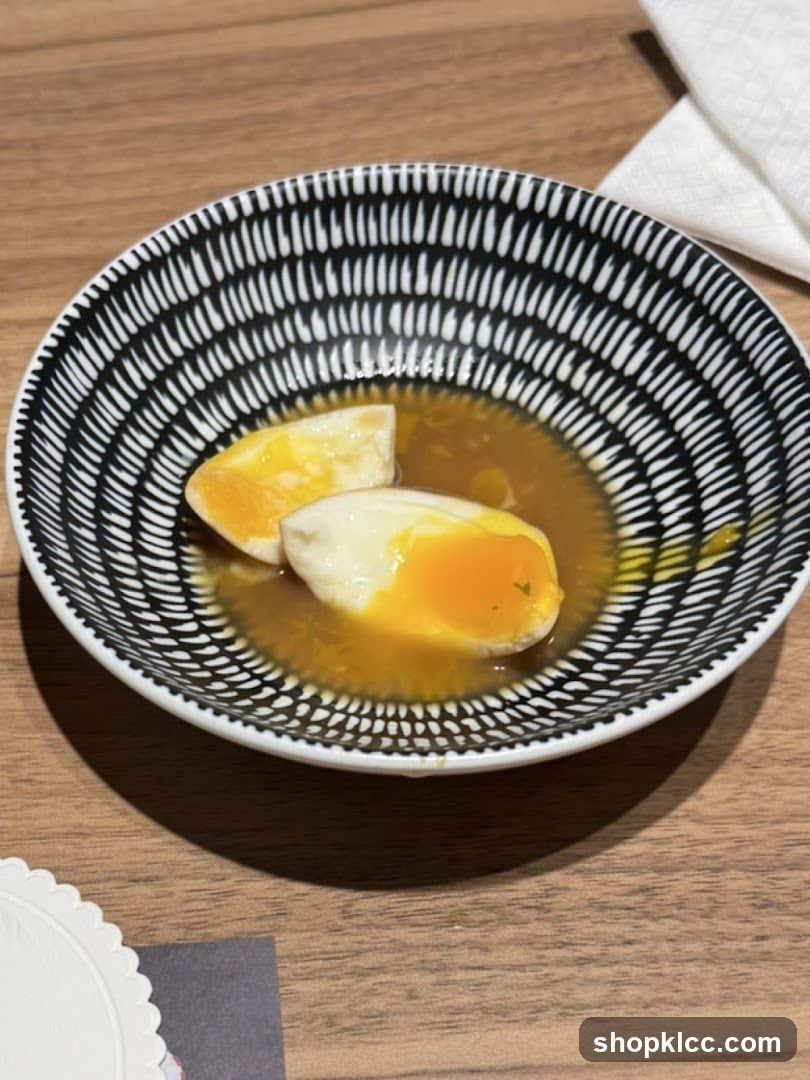 Soft-boiled eggs in broth