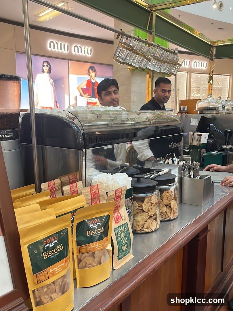Coffee counter with biscotti and staff