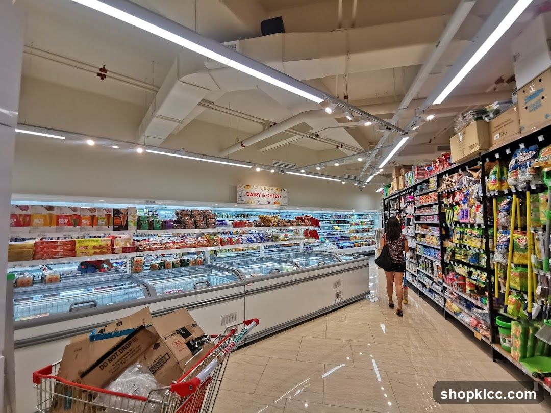 Supermarket aisle with frozen goods and shelves of products