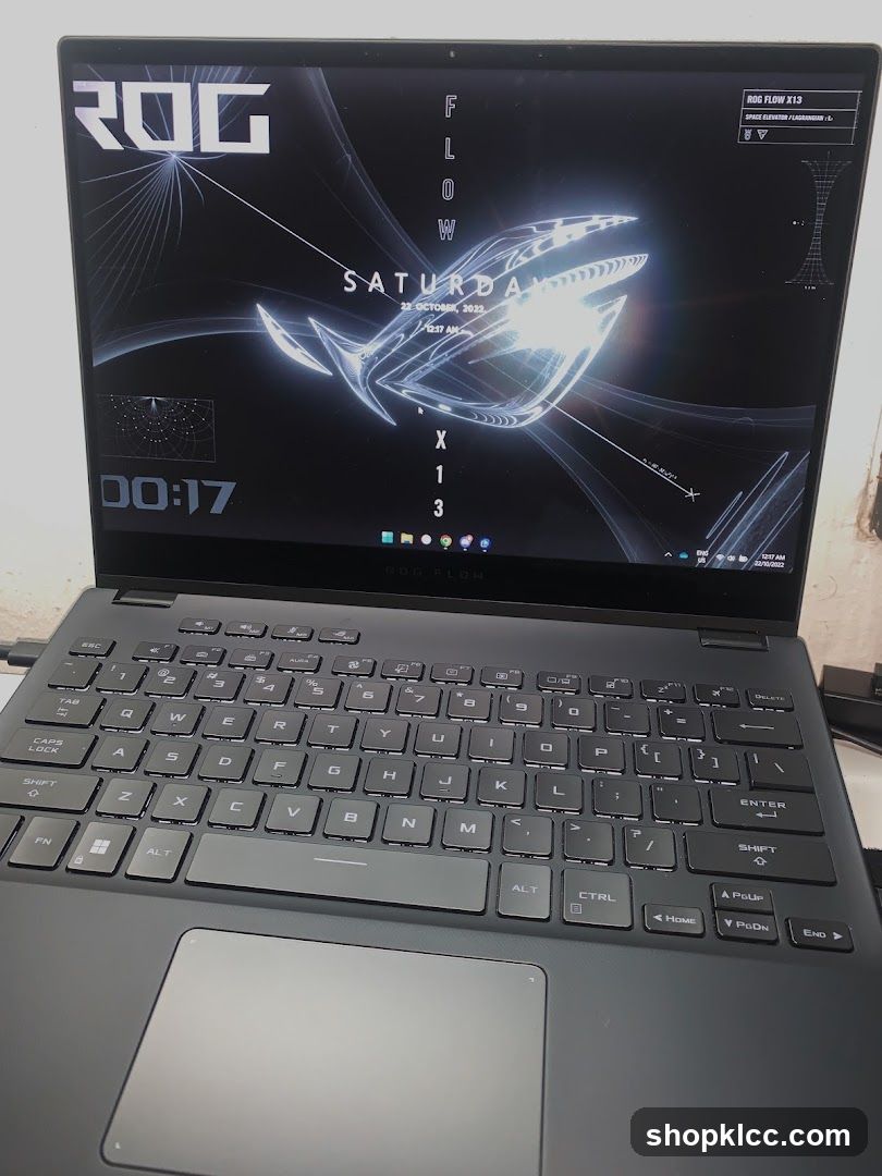 Laptop with ROG wallpaper