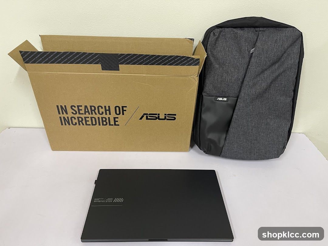 ASUS Laptop, Backpack, and Box
