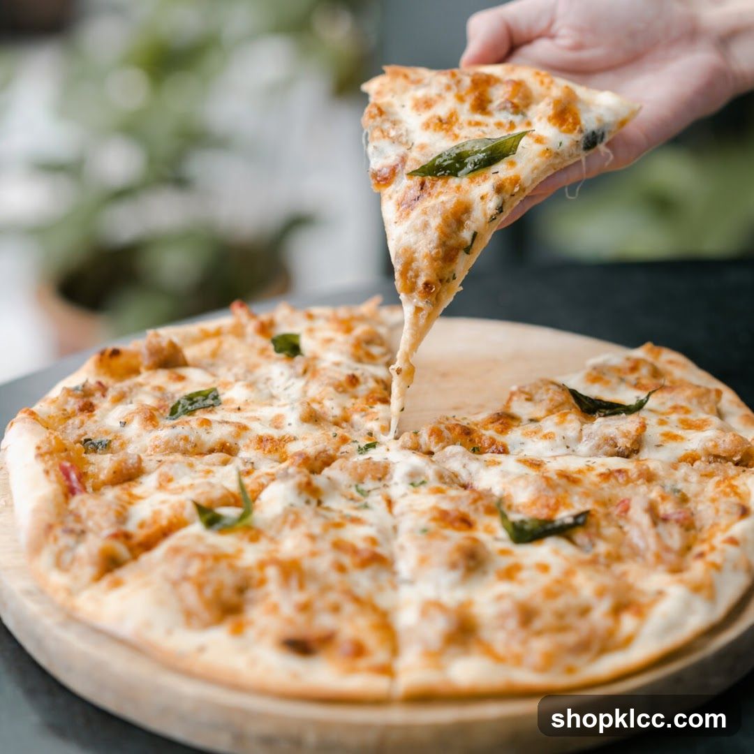 Pizza Slice Being Lifted