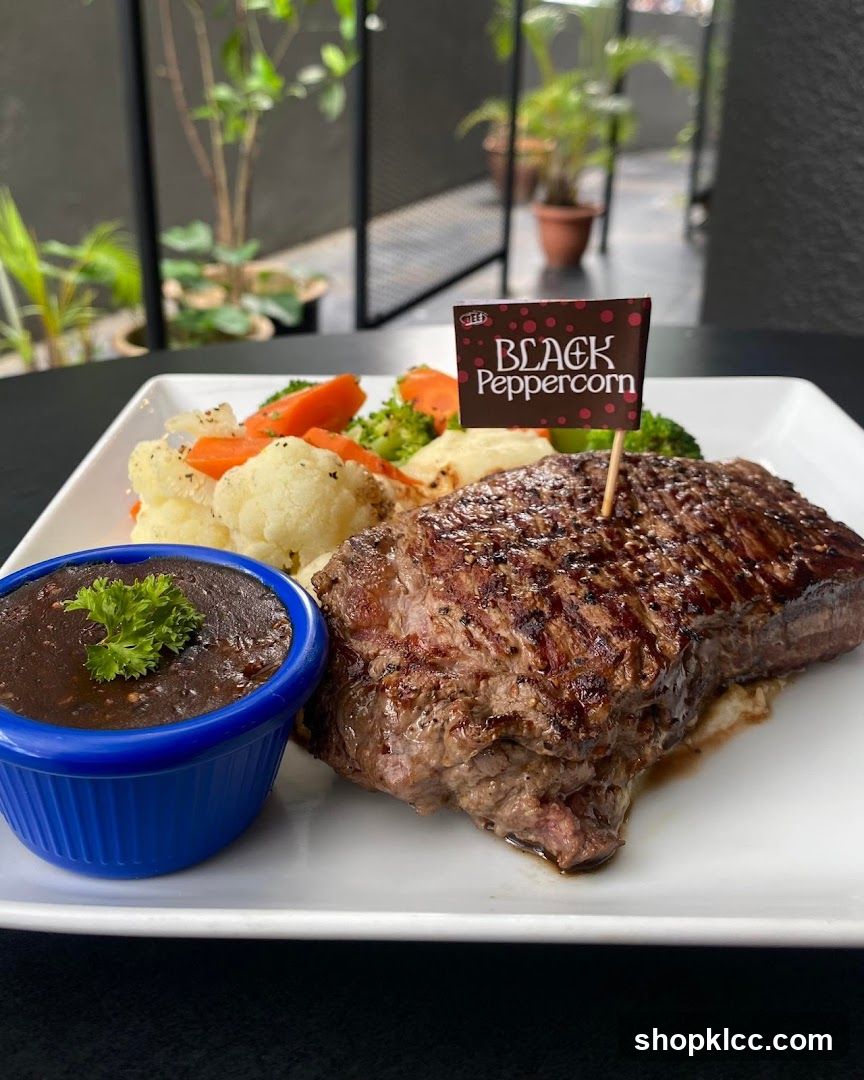 Steak with Black Peppercorn Sauce and Vegetables