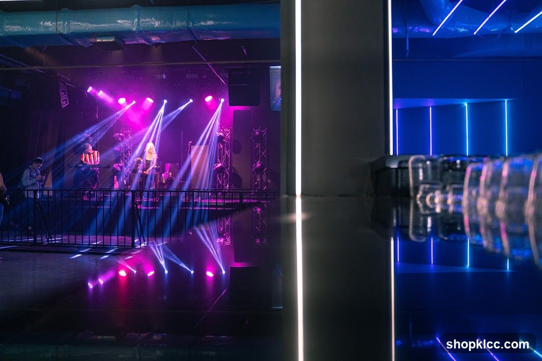 Stage with Performers and Neon Lights