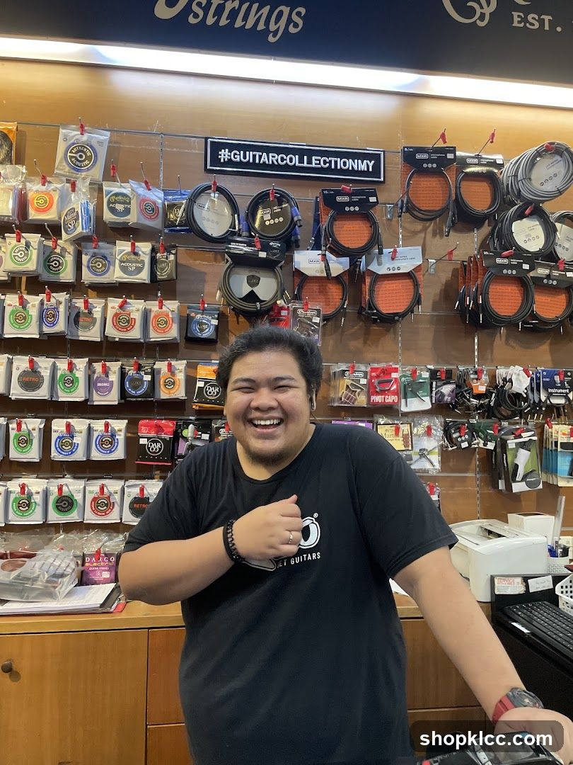 Man in Guitar Shop