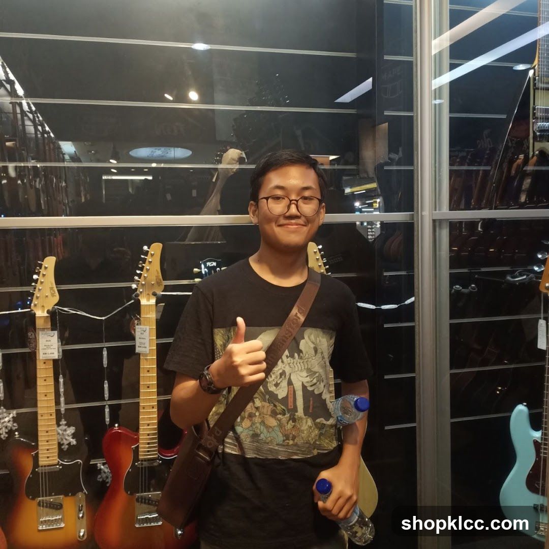 Man in a Guitar Store