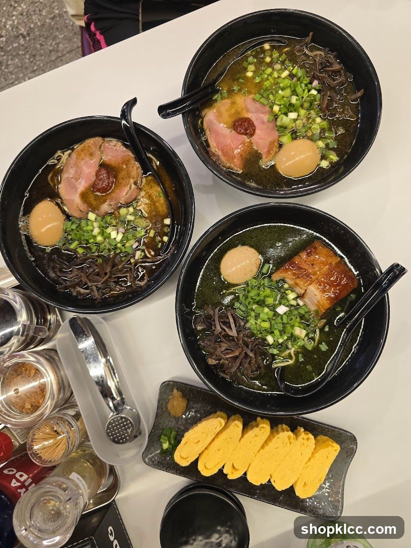 Three bowls of ramen and tamagoyaki