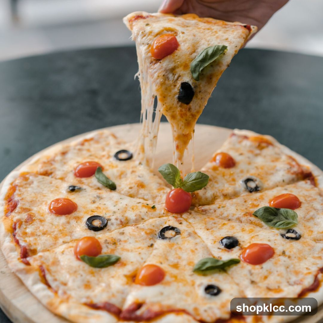 Pizza Slice Being Lifted