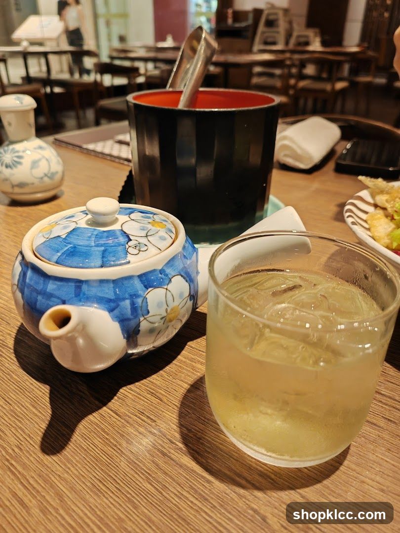 Table Setting with Teapot and Drink