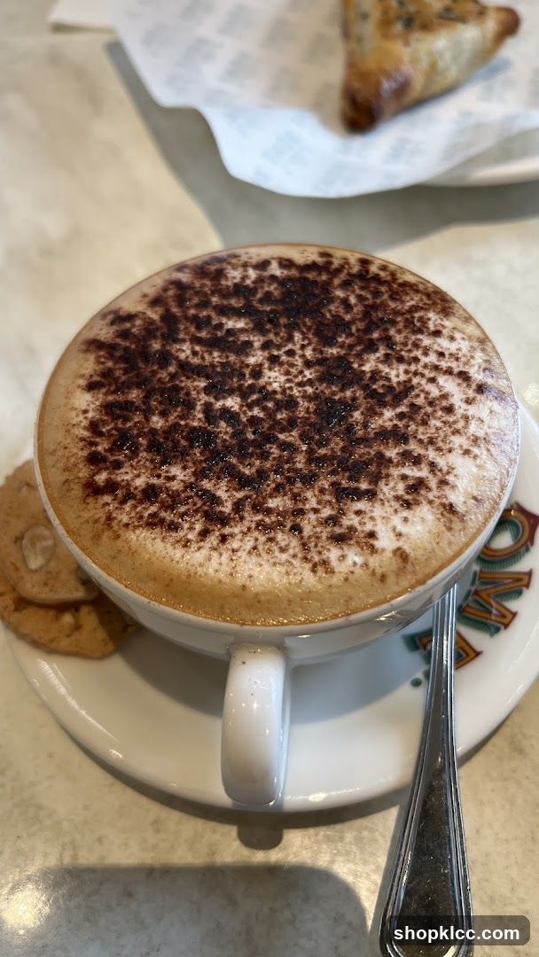 Cappuccino with cookies and pastry