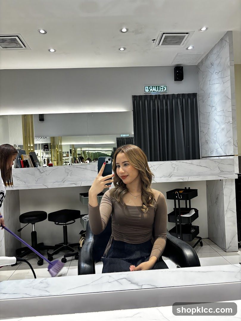 Woman taking a selfie in a salon