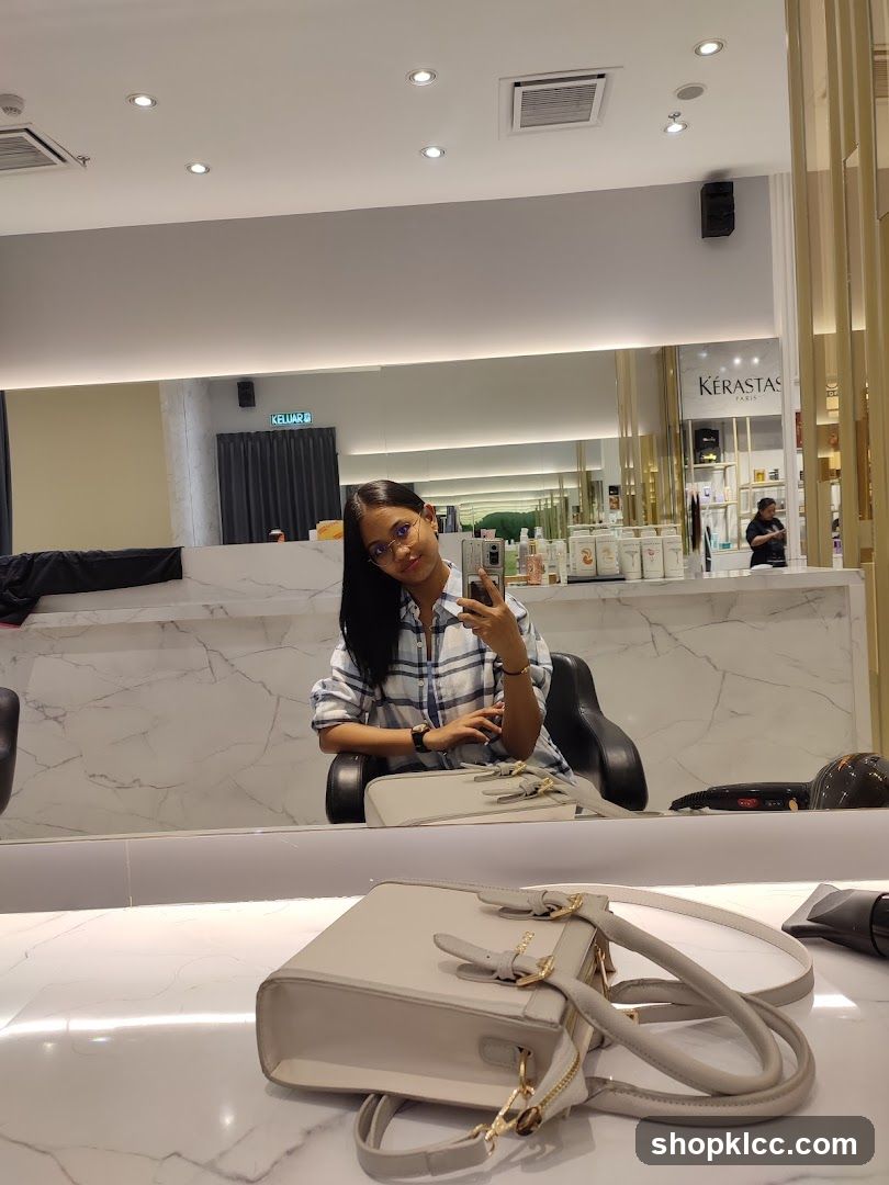 Woman taking a selfie in a salon