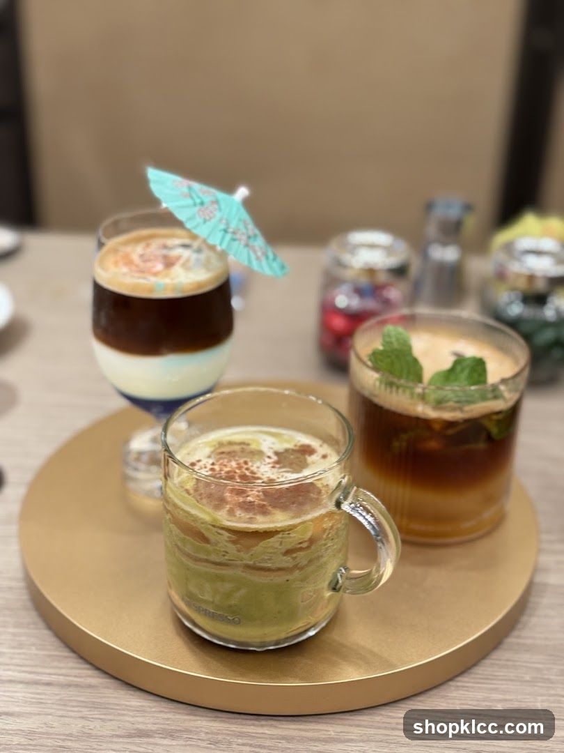 Three layered drinks on a tray