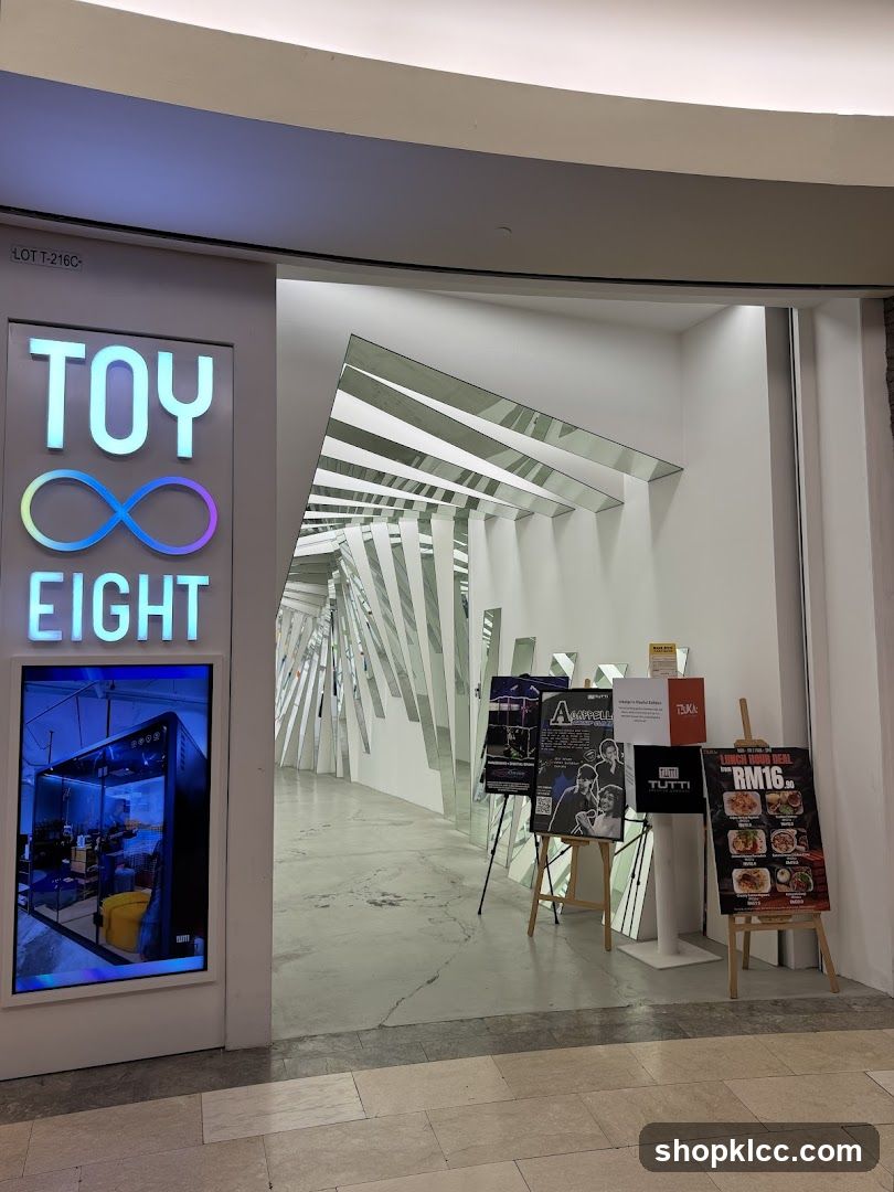 Entrance with mirrored art installation and promotional displays