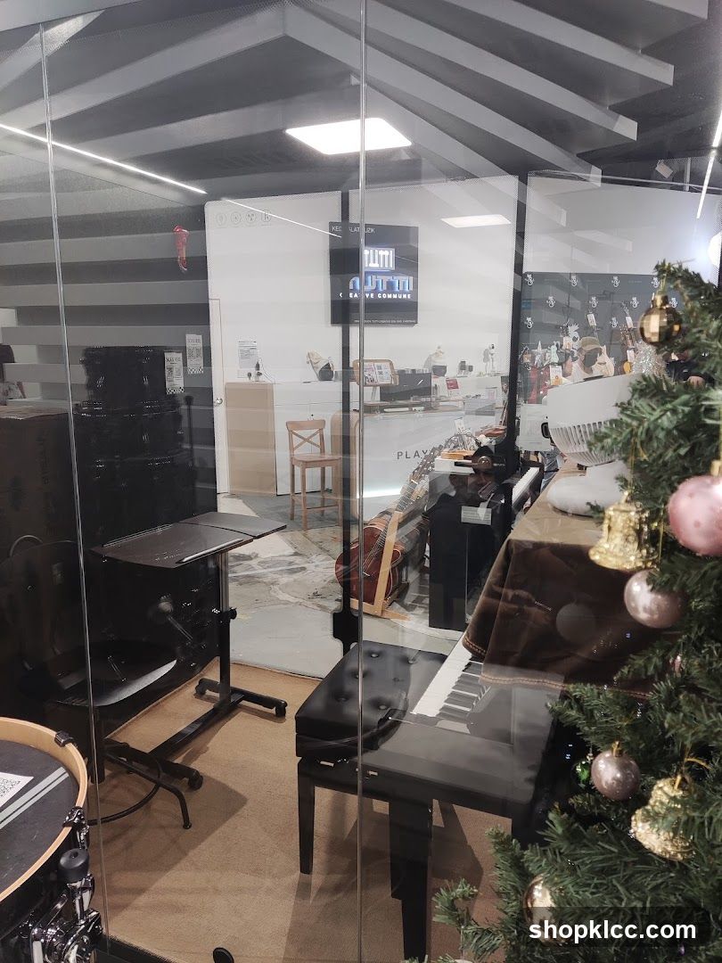 Music store interior with piano and Christmas tree