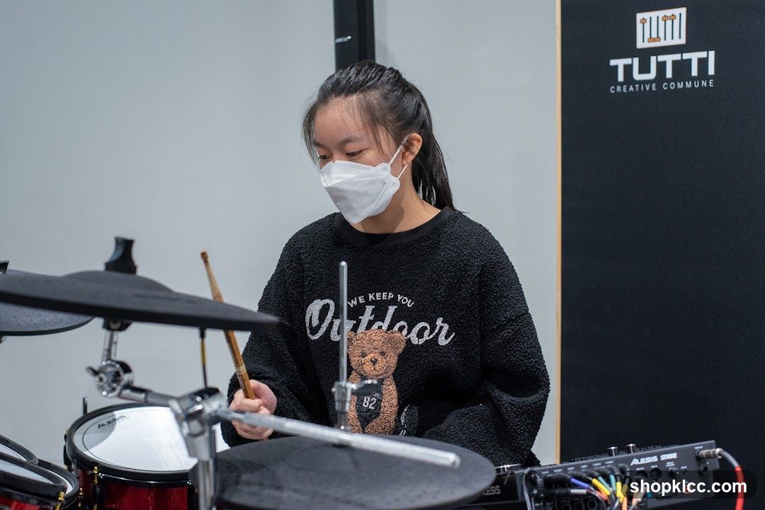 Young person playing drums