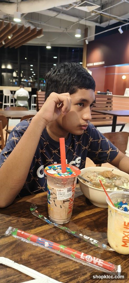 Boy with drinks and food