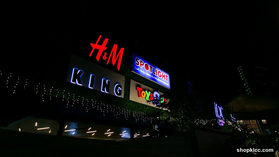 Nighttime view of illuminated store signs