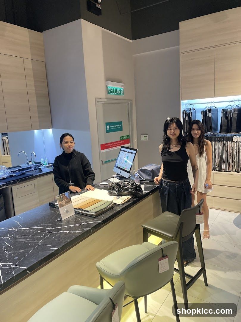 Interior of a store with staff and customers