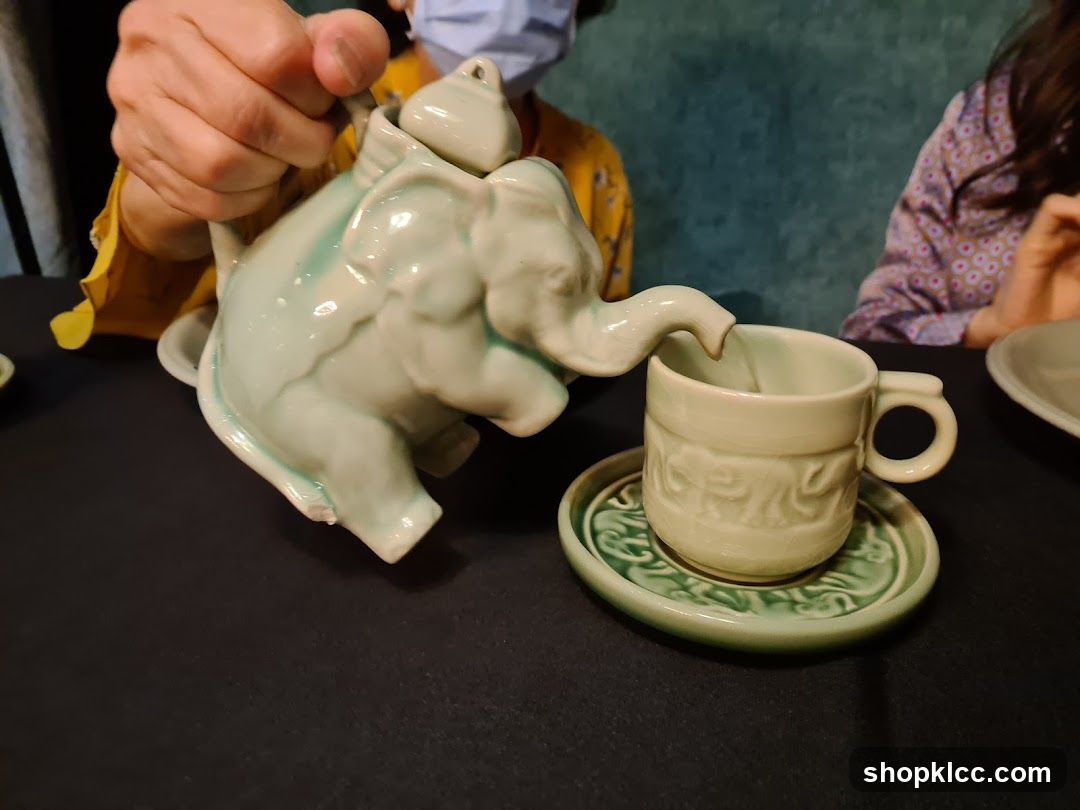 Elephant Teapot Pouring Tea