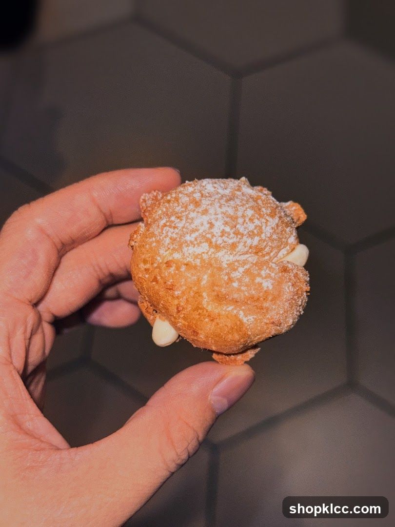 Hand holding a pastry
