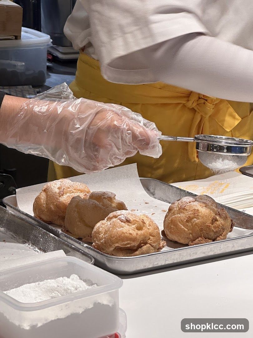 Dusting Cream Puffs with Powdered Sugar