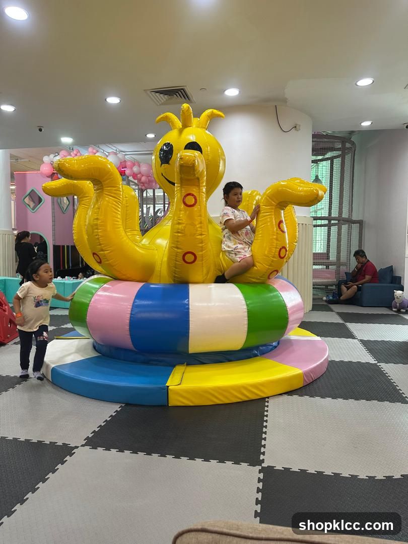 Children playing on an inflatable octopus