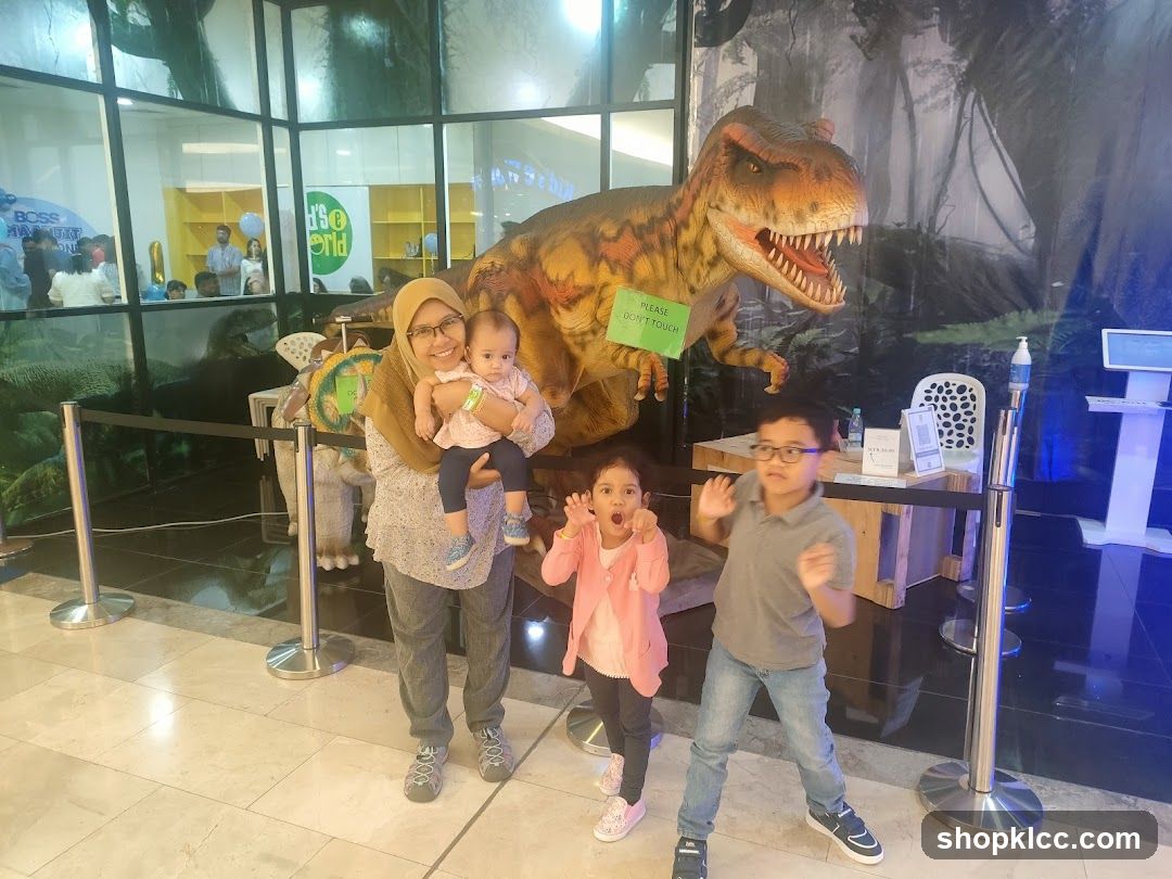 Family Poses with Dinosaur Exhibit