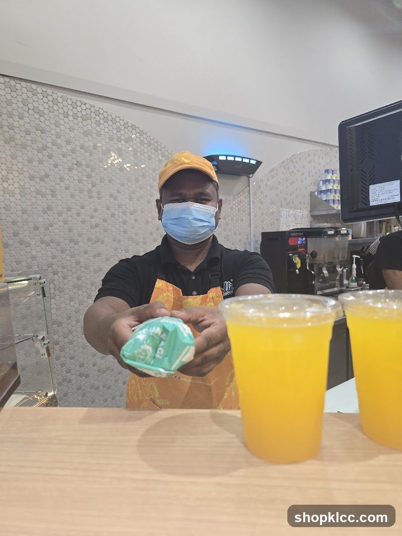 Staff member offering a food item