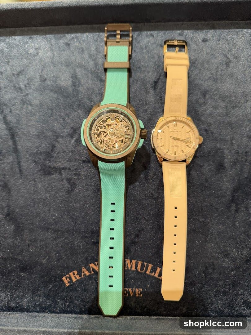 Two watches on a dark blue velvet surface