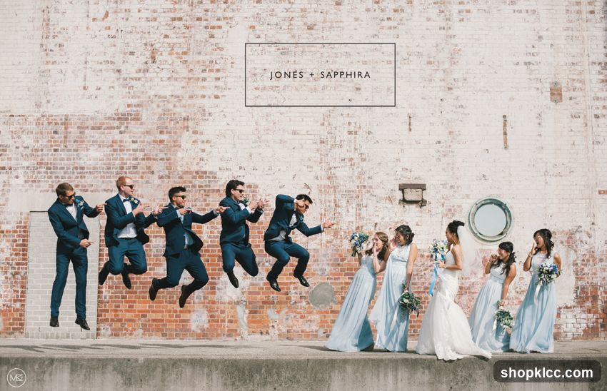 Wedding Party Posing Against Brick Wall