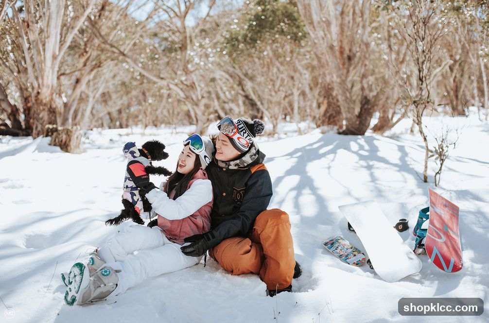 Couple with dog in snow