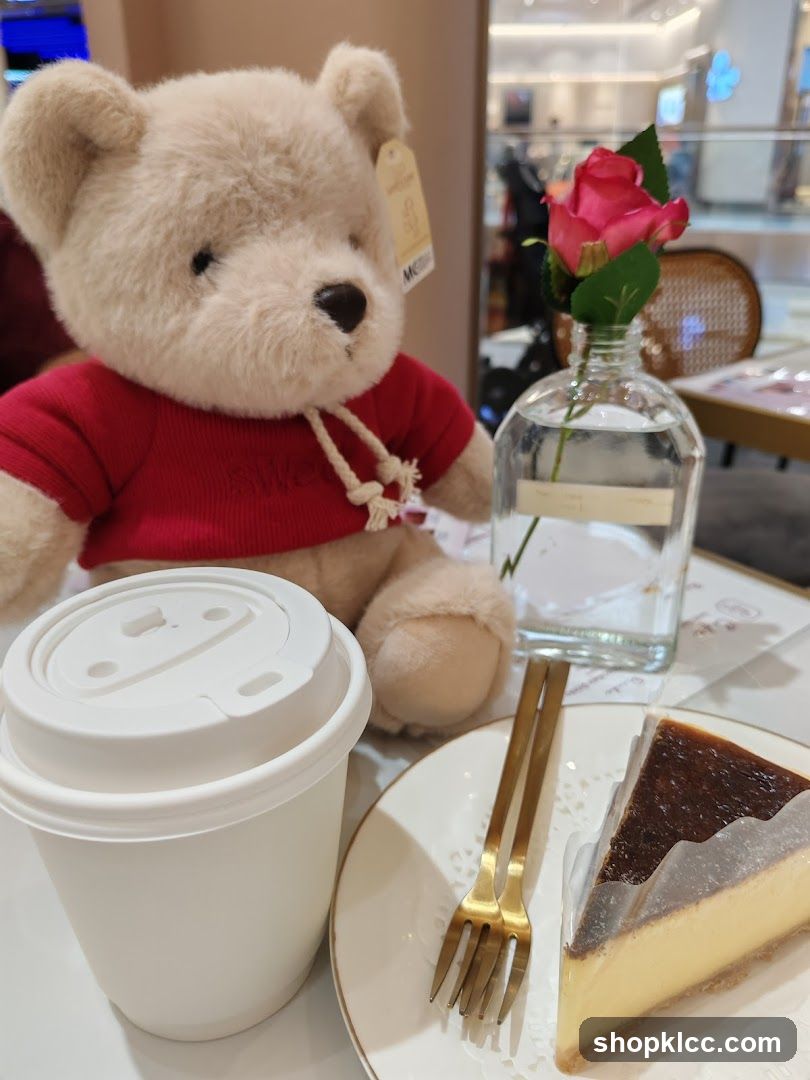 Teddy bear with coffee and cheesecake