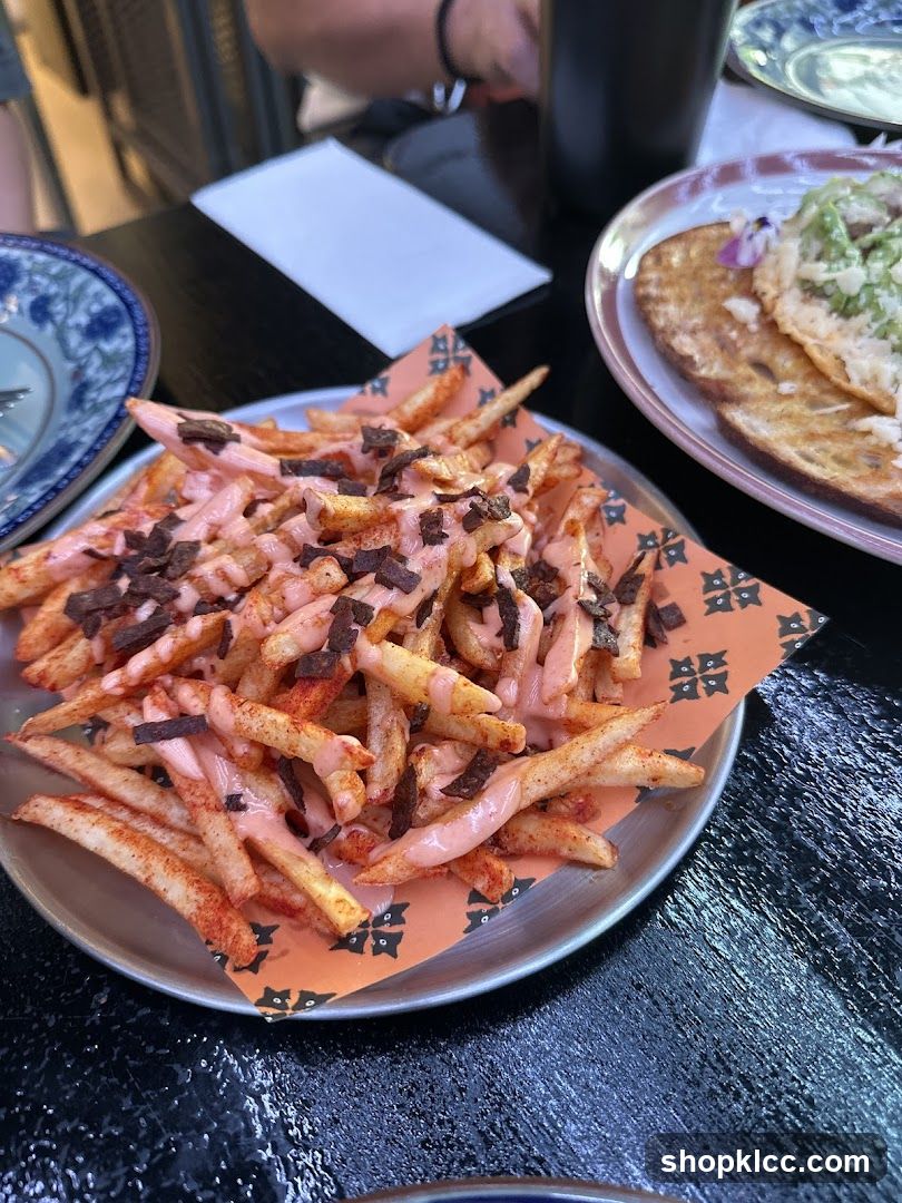 Fries with pink sauce and toppings