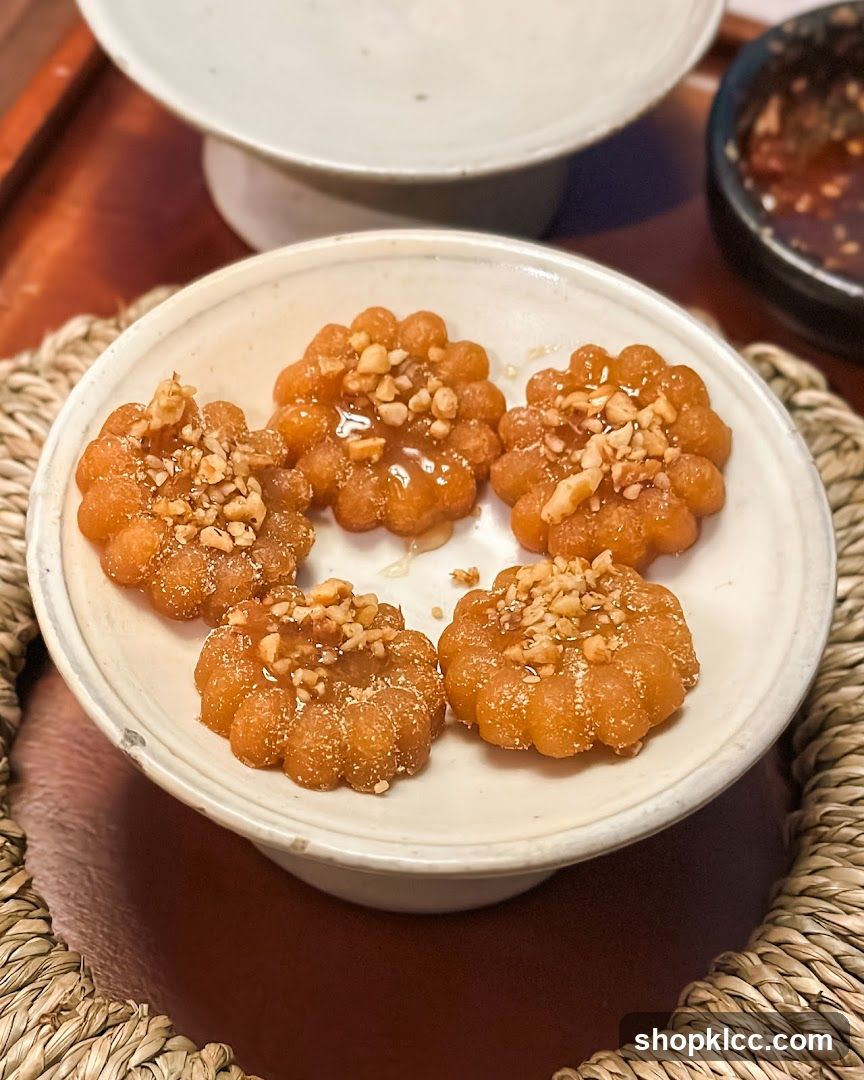 Flower-shaped cookies with nuts and syrup