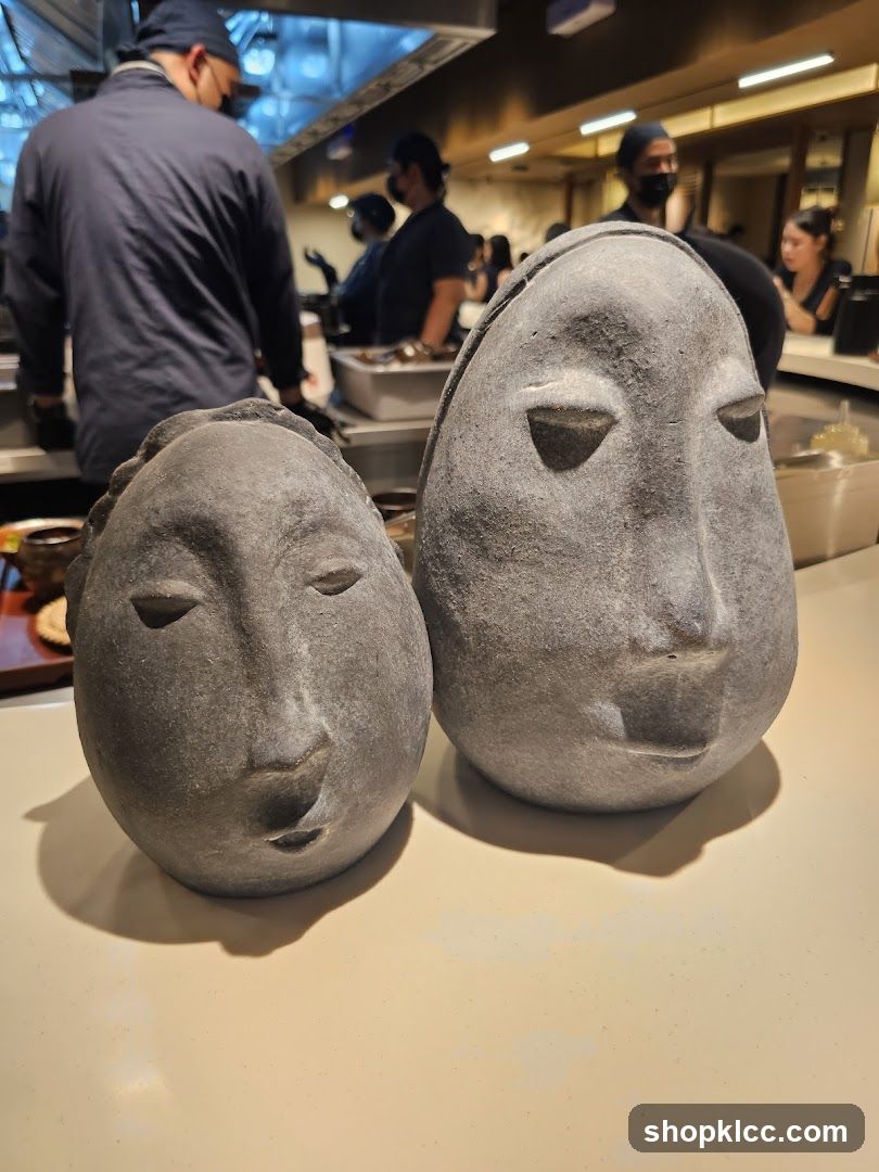 Stone Head Sculptures in Restaurant Kitchen