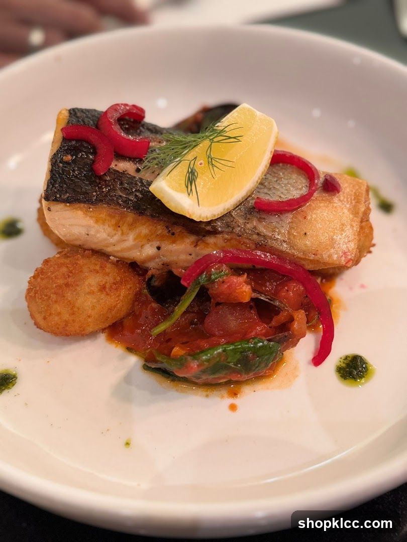 Salmon with lemon and red pepper garnish